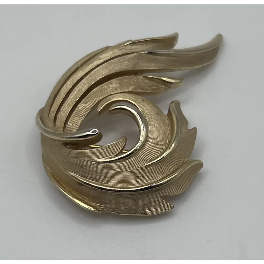 Vintage Crown Trifari Classic Textured Gold Tone Open Swirl Costume Brooch
